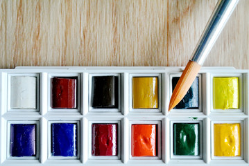 watercolors and brushes