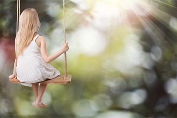 Child on swing.