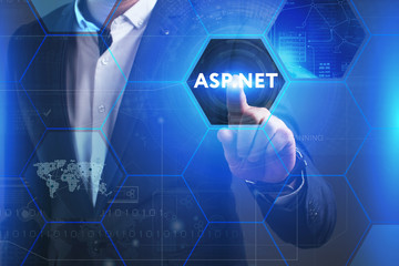 Business, Technology, Internet and network concept. Young businessman working on a virtual screen of the future and sees the inscription: ASP.NET