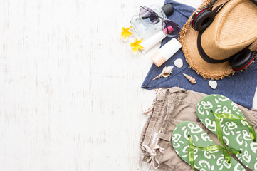 Men's casual summer clothes with accessories items on white rustic wooden board background, overhead top view, flay lay