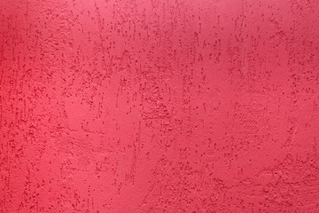 Plaster pink background. Old cement wall texture in red. Can be used as background or texture.