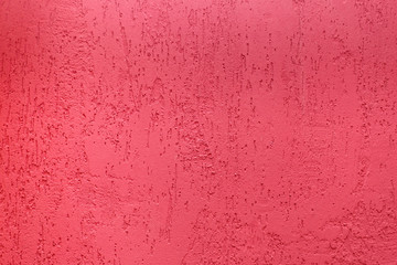 Plaster pink background. Old cement wall texture in red. Can be used as background or texture.
