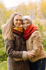  Happy mother and daughter portrait. Portrait of beautiful mature mother and her daughter .
