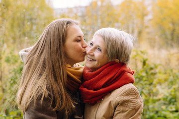 Fototapeta premium Happy mother and daughter portrait. Portrait of beautiful mature mother and her daughter . 