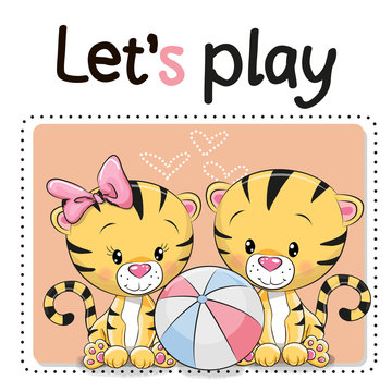 Two tigers with a ball