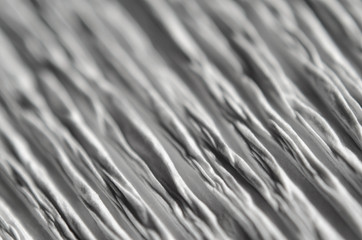 White texture of embossed paper. Macro. Shallow depth of field. Abstract background with deep...