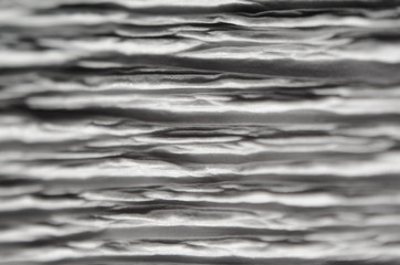 White texture of embossed paper. Macro. Shallow depth of field. Abstract background with deep...
