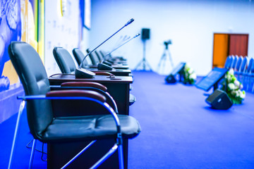 Conference room with microphones. Chairs in the conference hall.