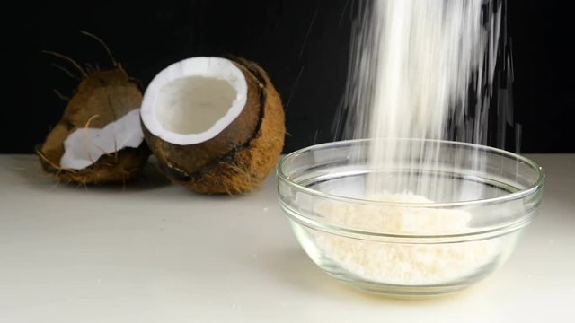 coconut chips fall in bowl