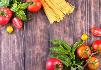 Close-up of fresh, ripe tomatoes on wood background