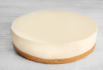 Delicious cheesecake on wooden background