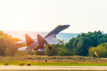 Fighter take off with a military military airfield.