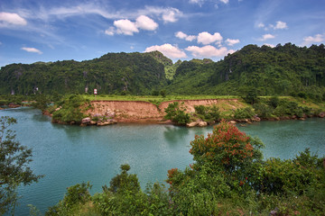 Turquoise clear river near the town of Phong Nha in the National Park of Phong Nha Ke Bang, Vietnam.