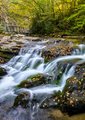 Fototapeta na wymiar scenic waterfall, autumn foliage
