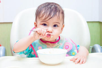 baby eating spoon