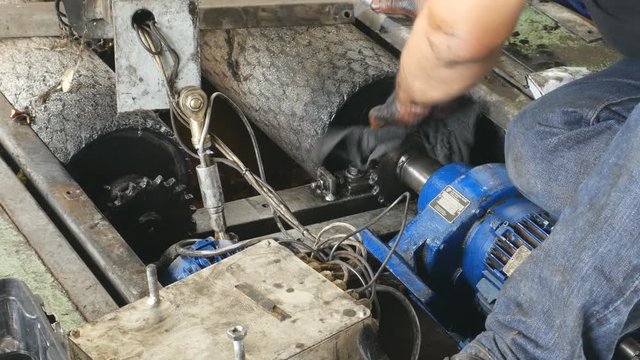 4k Video of hand of repairman use fabric cleaning and during maintenance work of gear of chain