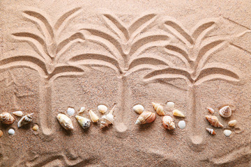 Palm trees drawn on beach sand