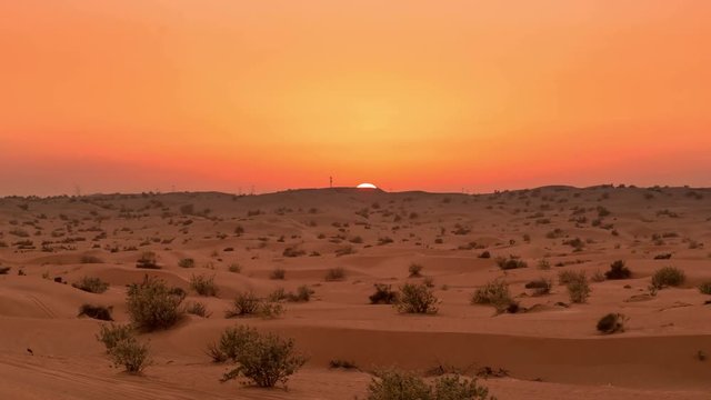 Golden sunset timelapse over the desert landscape in United Arab Emirates