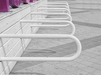 Empty bicycle rack on sidewalk