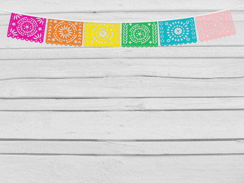 Brazilian june party, festa junina mockup. Birthday decorative scene. String of handmade cut paper flags. Party decoration. White wooden background, empty space. Top view.