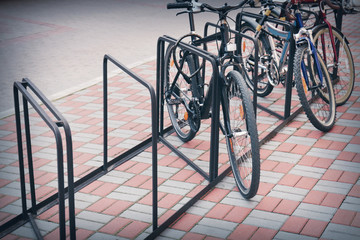 Bicycle rack with bikes on sidewalk