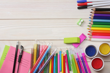 school and office supplies. school background. colored pencils, pen, pains, paper for  school and...
