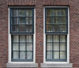 Fototapeta na wymiar Building with modern wooden windows