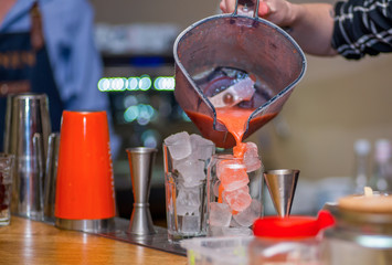 Bartender prepares a cocktail