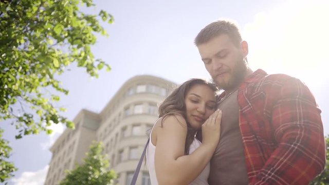 Happy couple meeting on a date in the city, steadycam shot