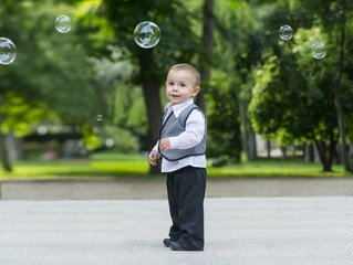 Boy playing with soap bubbles