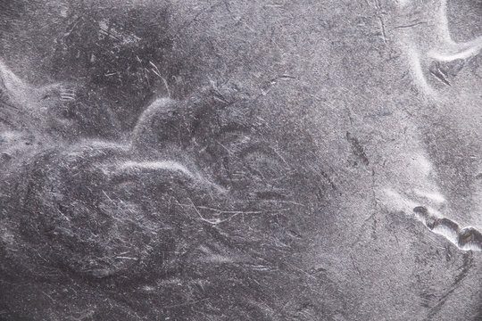 Close up abstract metal texture of a coin, microscopic background.