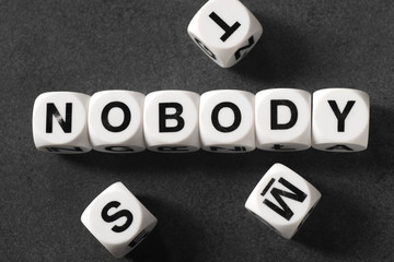 word nobody on toy cubes