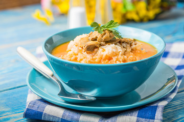 Tomato soup with rice.