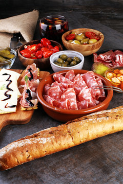 spanish tapas and sangria on wooden table - mediterran antipasti