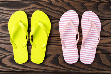 Flip flops on wooden background. Close up