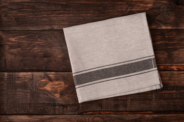 Top view of linen napkin on wooden table