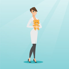 Pediatrician doctor holding teddy bear.