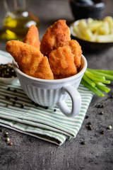 Breaded mini chicken fillets with potato
