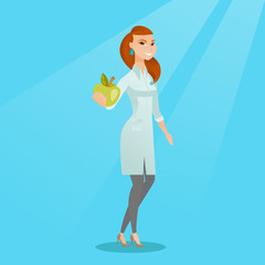 Nutritionist offering fresh apple.