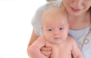 Young mother holding her newborn child.