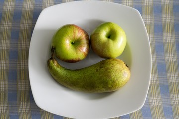 Apples and pear on a plate. Slovakia