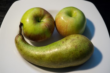Apples and pear on a plate. Slovakia