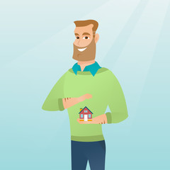 Insurance agent protecting model of house.