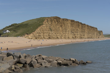 The Jurassic coastline viewed from the harbour entrance at West Bay in West Dorset England UK. June...