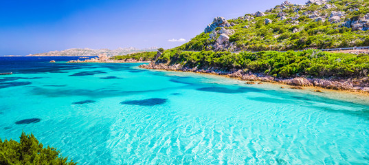 Emerald green sea water and rocks on coast of Maddalena island, Sardinia, Italy - obrazy, fototapety, plakaty