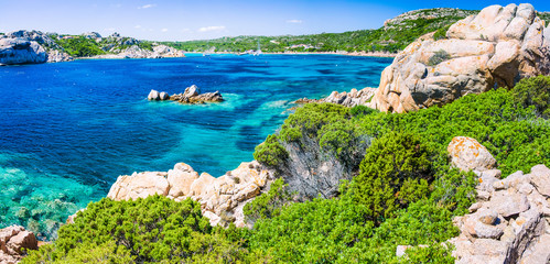 Emerald green sea water and rocks on coast of Maddalena island, Sardinia, Italy