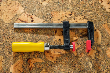C Clamp, C Clamp lock on wooden background, Mechanic concept