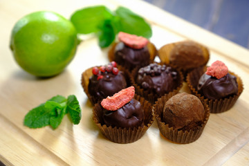 Delisious truffles, lime and fresh leaves of mint