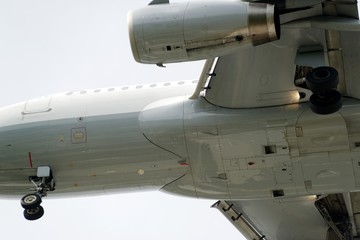 The underside of a modern airplane and its landing gear