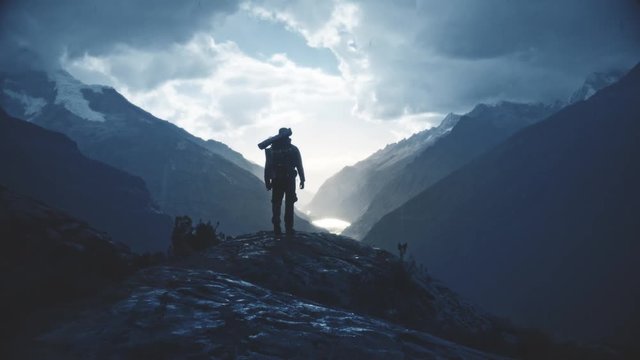 Silhouette of a backpacker walking on the peak of a mountain, Santa cruz Trek, Peru. 4k	